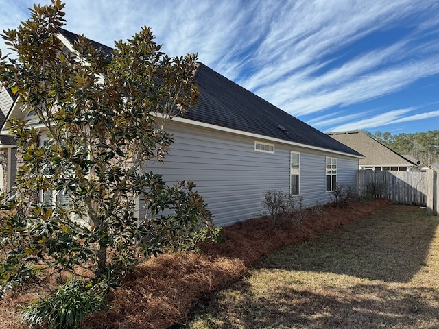 view of side of property featuring a yard