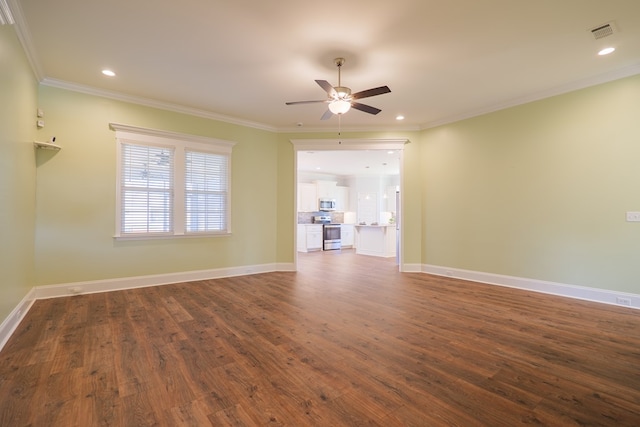 unfurnished living room featuring ceiling fan, dark hardwood / wood-style flooring, and ornamental molding