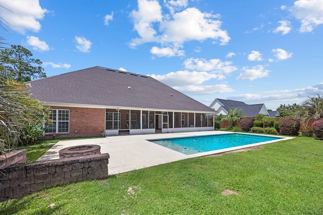 1166 Old Meadow Rd, Valdosta, GA 31605 - view of swimming pool featuring a sunroom, a patio area, a fire pit, and a yard