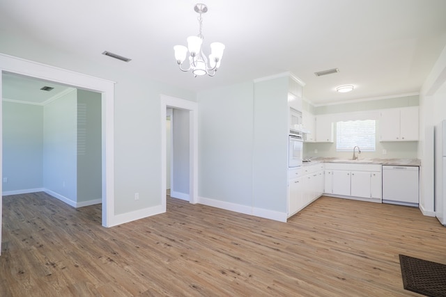 kitchen with sink, crown molding, light hardwood / wood-style floors, white appliances, and white cabinets