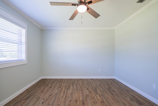 spare room featuring ceiling fan, dark hardwood / wood-style flooring, and ornamental molding