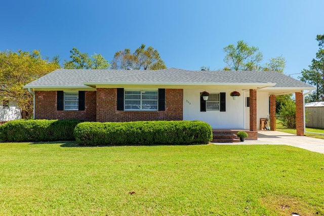 ranch-style home with covered porch and a front yard