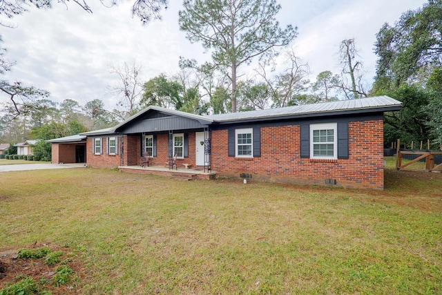 ranch-style house with a carport, a front yard, and covered porch