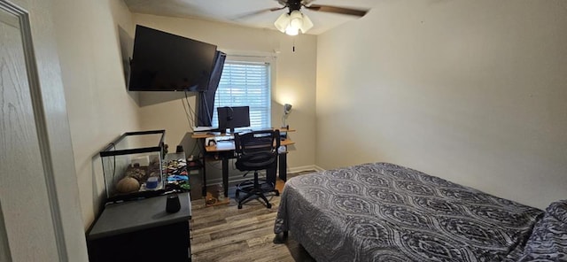 bedroom with hardwood / wood-style floors