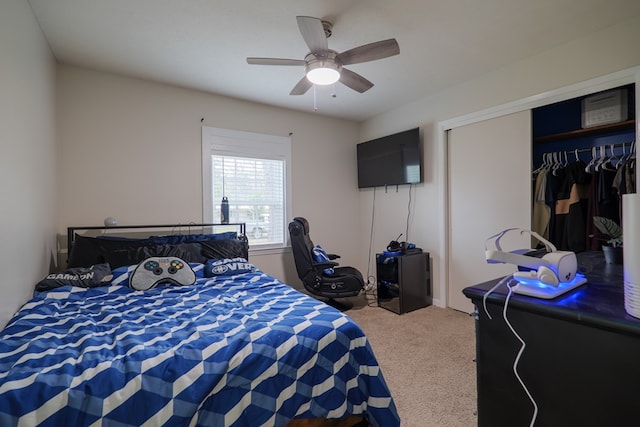 bedroom featuring a closet, ceiling fan, and carpet flooring