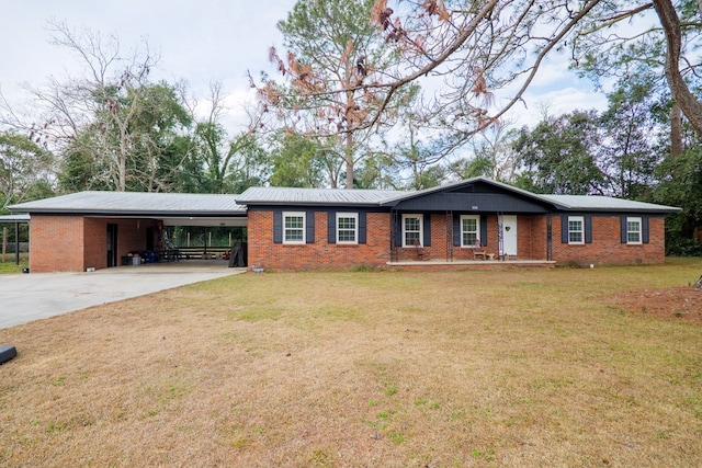 ranch-style home with a carport and a front lawn