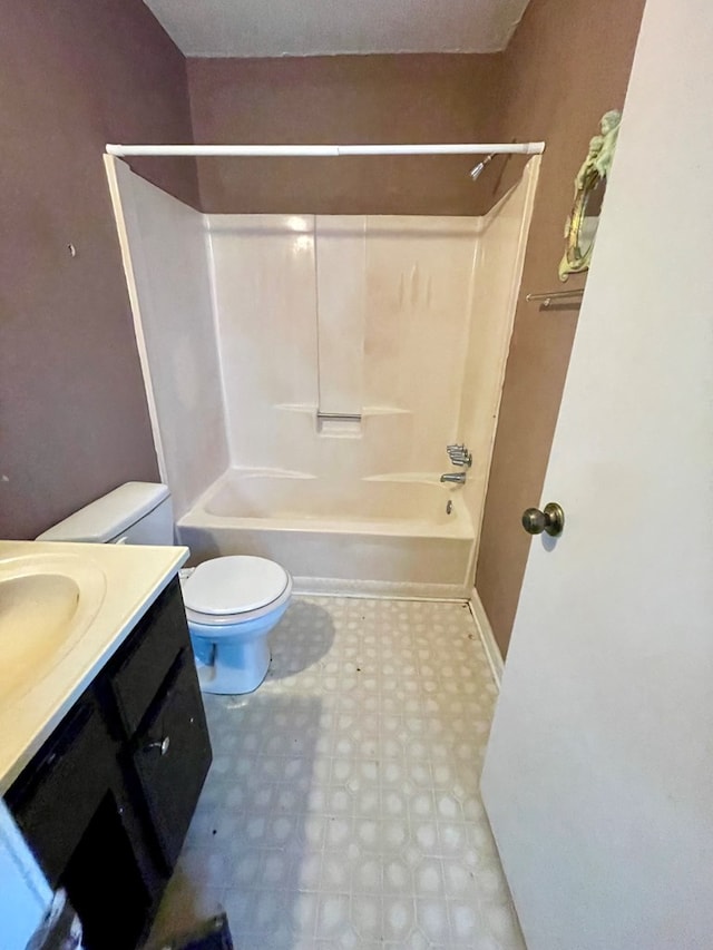 full bath with tile patterned floors, tub / shower combination, toilet, and vanity