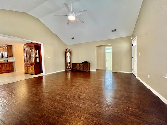 unfurnished living room with ceiling fan and lofted ceiling