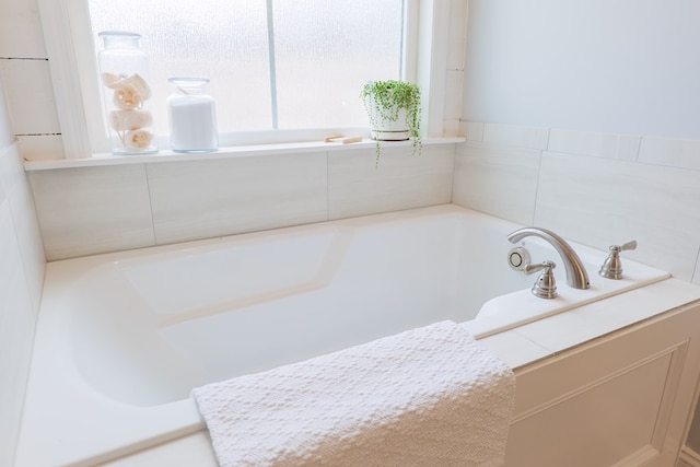 bathroom with tiled bath