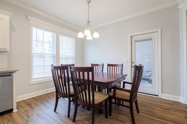 dining space featuring crown molding, a chandelier, and dark wood-type flooring