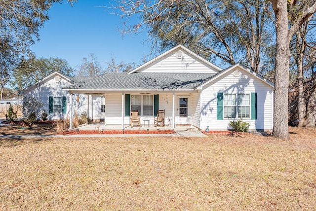 ranch-style house with a front lawn and a porch