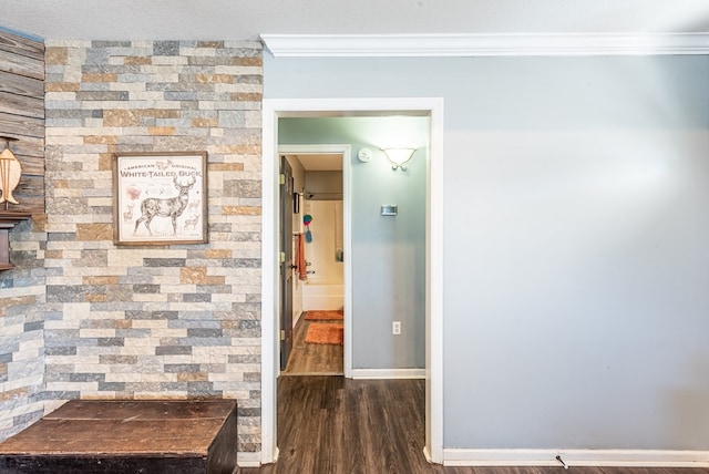 hall featuring crown molding and dark wood-type flooring