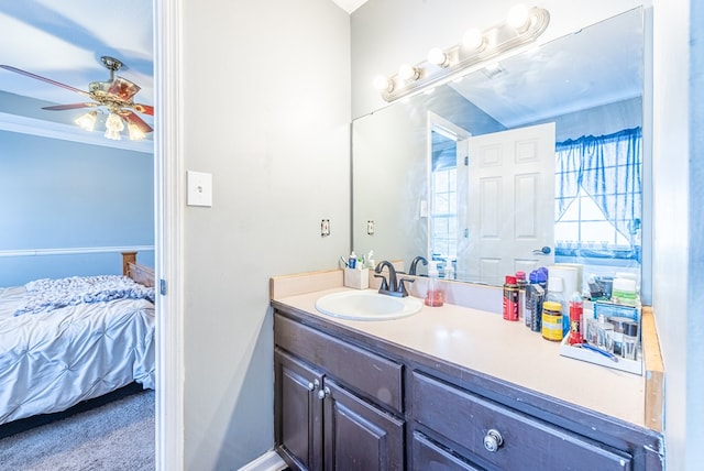 bathroom with vanity, crown molding, and ceiling fan