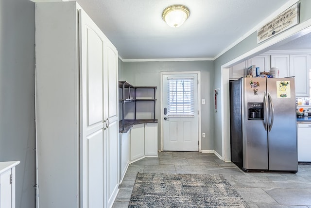 kitchen featuring white cabinetry, dishwasher, stainless steel fridge, and ornamental molding