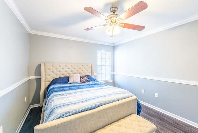 bedroom featuring ornamental molding, dark hardwood / wood-style floors, and ceiling fan