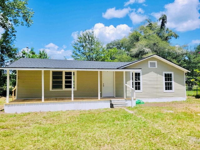 view of front of home with covered porch and a front yard