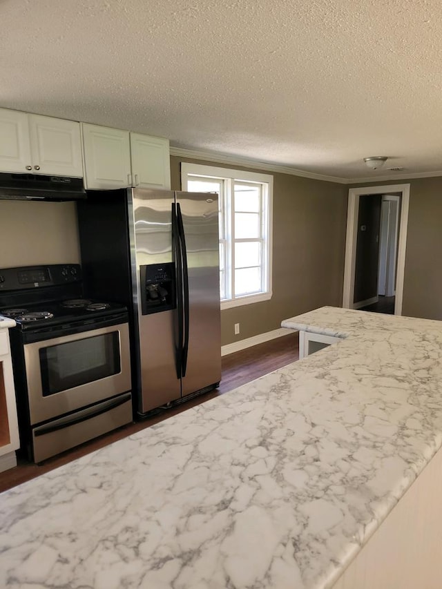 kitchen featuring white cabinets, dark hardwood / wood-style floors, ornamental molding, a textured ceiling, and stainless steel appliances