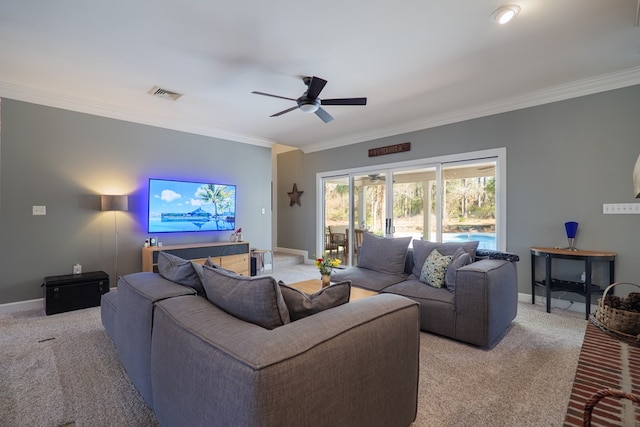 living room with baseboards, visible vents, and crown molding