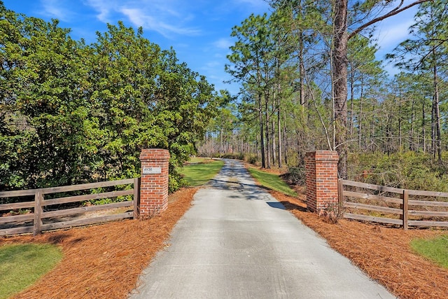 view of gate with fence