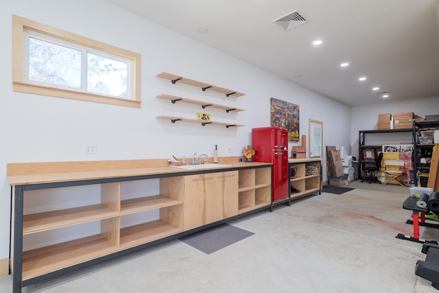 interior space featuring visible vents, a sink, and recessed lighting