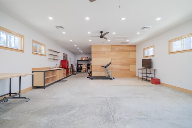 workout area with baseboards, visible vents, and recessed lighting