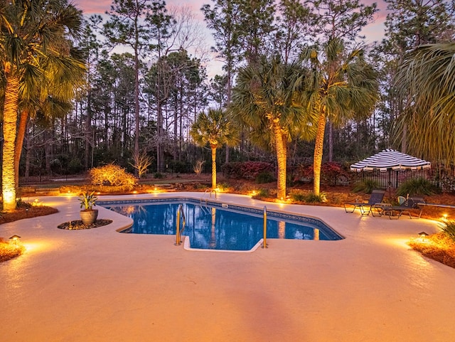 outdoor pool with a patio area