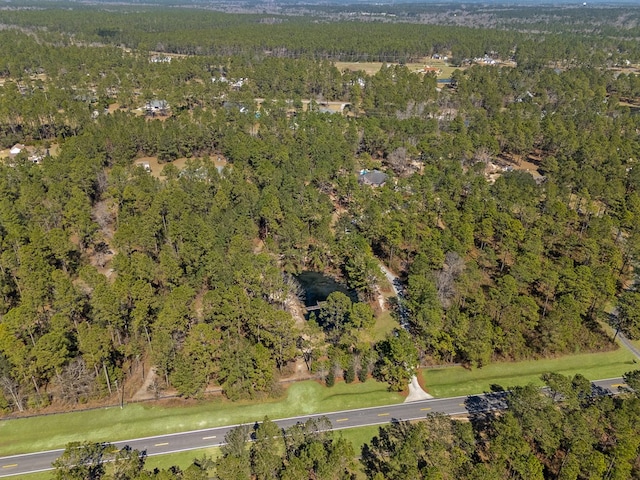 bird's eye view featuring a view of trees