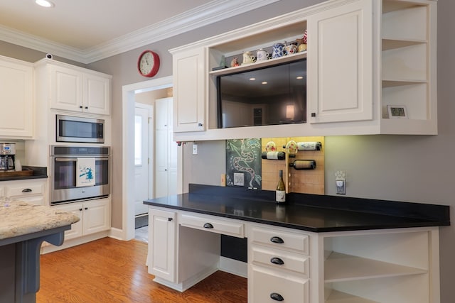 kitchen featuring light wood-style floors, appliances with stainless steel finishes, and open shelves