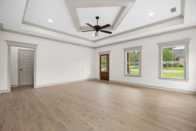 2204 N Oak St, Valdosta, GA 31602 - spare room with a tray ceiling, crown molding, a ceiling fan, light wood finished floors, and recessed lighting