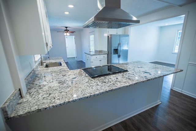 2205 Park Ln, Valdosta, GA 31602 - kitchen featuring black electric cooktop, island range hood, a peninsula, white cabinets, and stainless steel fridge with ice dispenser