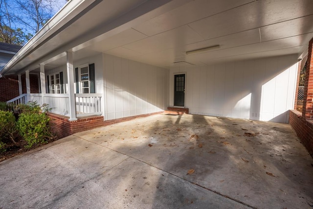 2205 Park Ln, Valdosta, GA 31602 - exterior space featuring covered porch, an attached carport, and concrete driveway