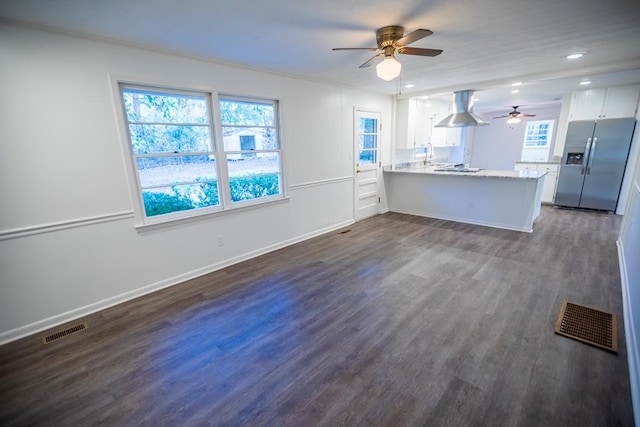 2205 Park Ln, Valdosta, GA 31602 - kitchen featuring island range hood, a peninsula, visible vents, white cabinetry, and stainless steel fridge with ice dispenser