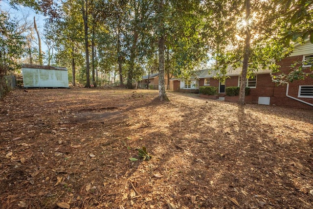 2205 Park Ln, Valdosta, GA 31602 - view of yard featuring an outbuilding and a storage shed
