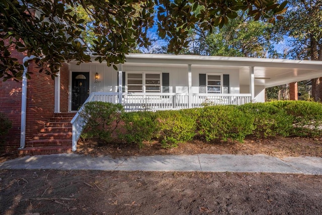 view of front of property with a porch and brick siding