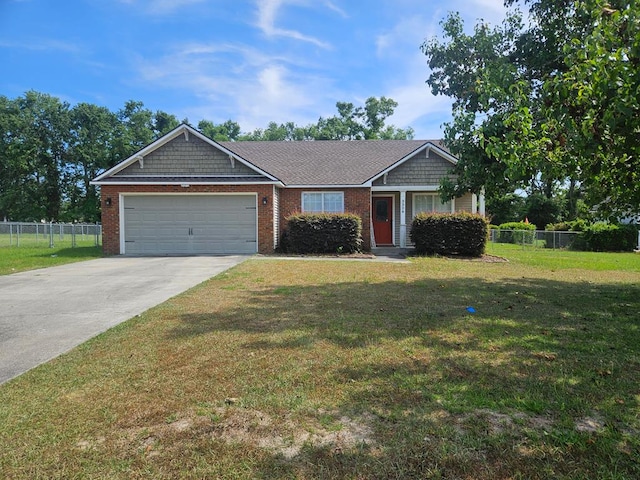view of front of property featuring concrete driveway, fence, a front lawn, and a garage
