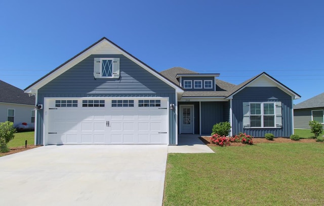 3968 Lu Ln, Hahira, GA 31632 - view of front of house featuring board and batten siding, a garage, roof with shingles, a front lawn, and concrete driveway