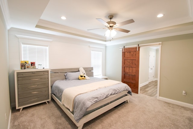 3968 Lu Ln, Hahira, GA 31632 - bedroom with baseboards, a raised ceiling, a barn door, ornamental molding, and light carpet