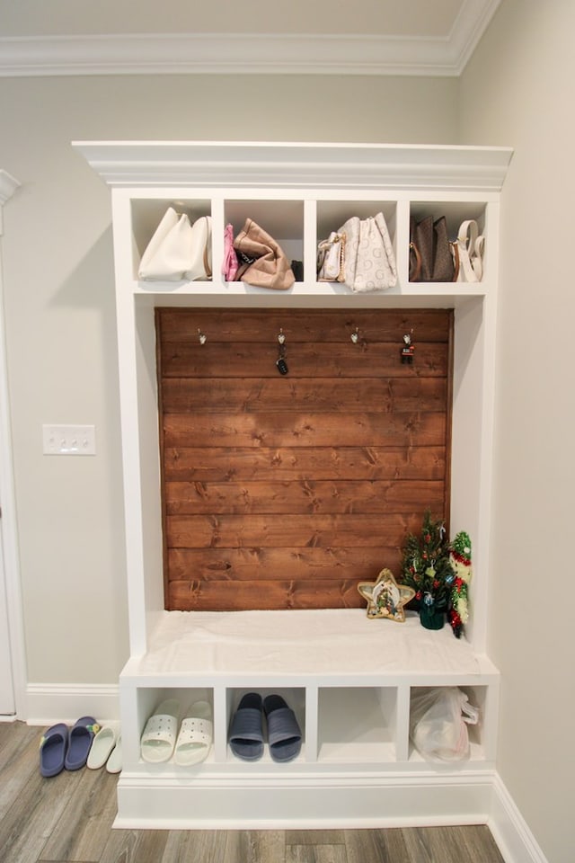 3968 Lu Ln, Hahira, GA 31632 - mudroom featuring crown molding, baseboards, and wood finished floors