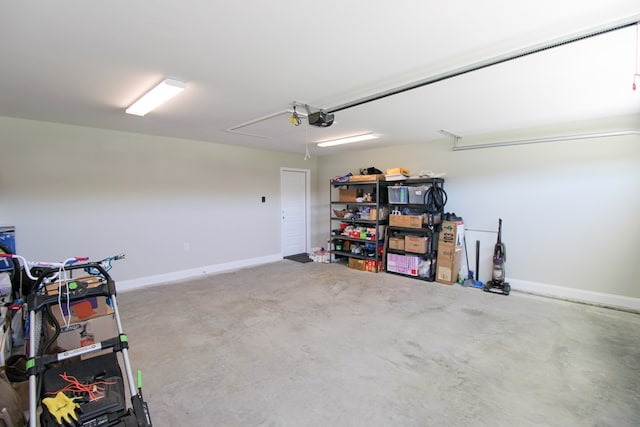 3968 Lu Ln, Hahira, GA 31632 - garage featuring a garage door opener and baseboards