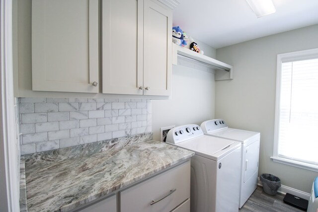 3968 Lu Ln, Hahira, GA 31632 - washroom with cabinet space, washing machine and dryer, and wood finished floors
