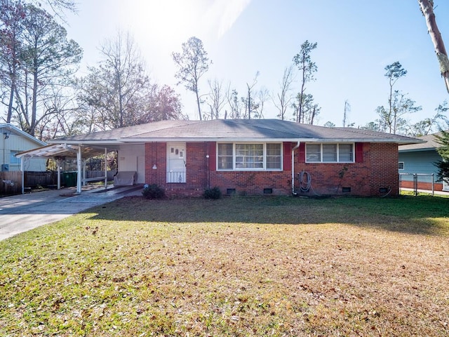 single story home featuring a carport and a front yard