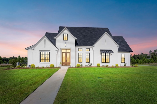 modern farmhouse featuring a yard