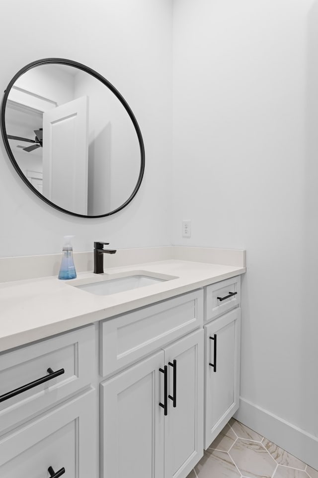 bathroom featuring ceiling fan and vanity