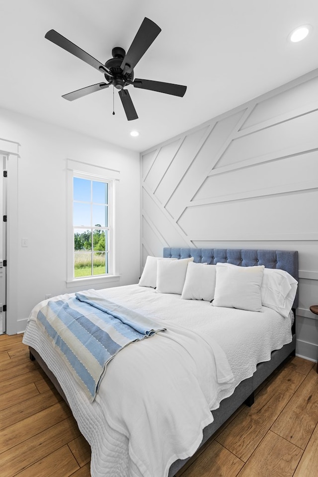 bedroom featuring wood-type flooring and ceiling fan