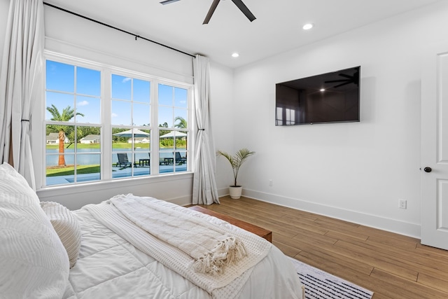 bedroom featuring hardwood / wood-style floors and ceiling fan