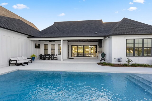 back of property featuring outdoor lounge area, ceiling fan, and a patio