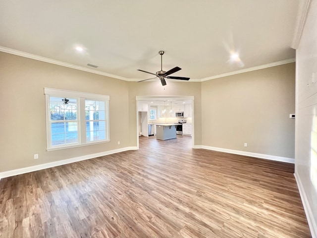 unfurnished living room featuring crown molding, light hardwood / wood-style flooring, and ceiling fan