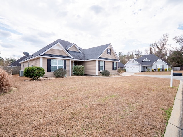 view of front of house featuring central AC unit and a garage