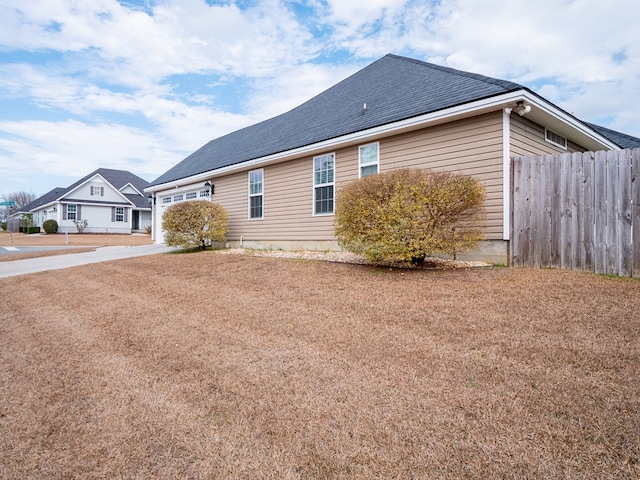 view of side of property featuring a garage