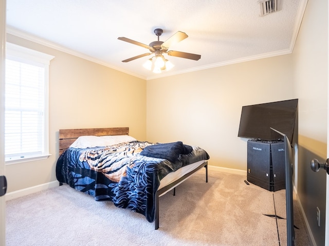 bedroom featuring ceiling fan, ornamental molding, and light carpet